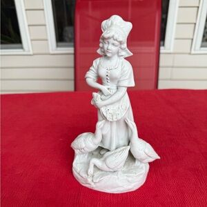 German Bisque figurine. Girl with Geese .